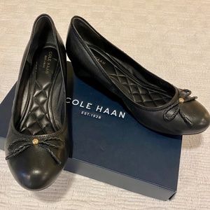 Mint Cole Haan black wedge-heeled leather women’s shoes; size 9 1/2M